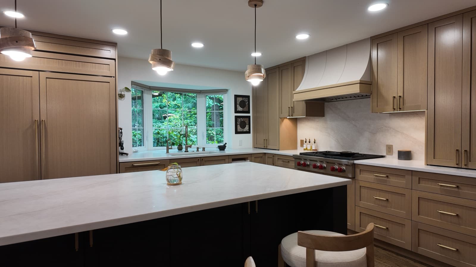Quartz counters and white-oak cabinetry in a finished ENF kitchen remodel, Bellevue WA